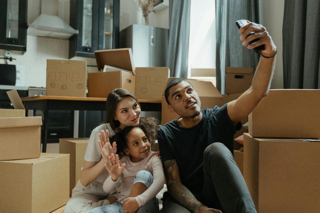 Happy family moving into new home after booking movers early