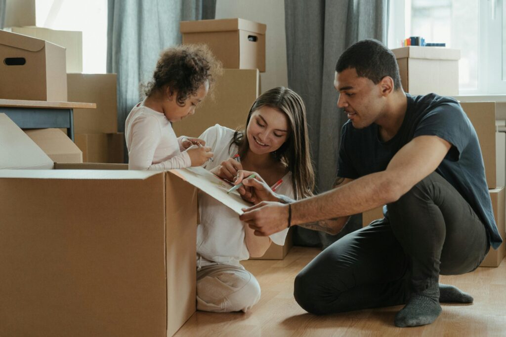 family unpacking new home after move using Movana virtual home inventory